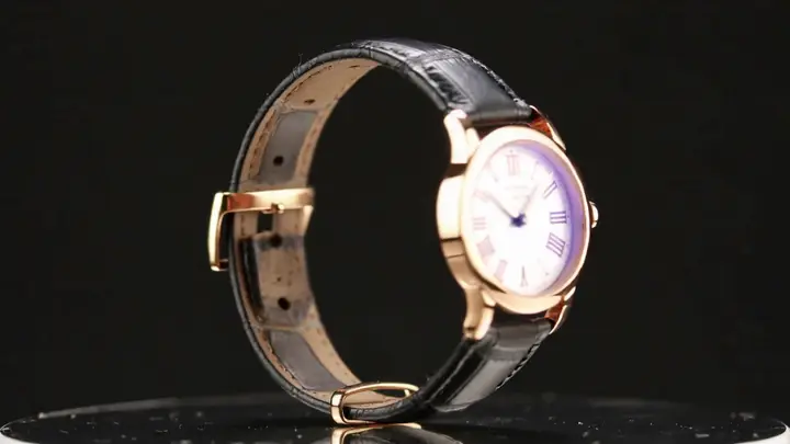 A luxury watch rotating in a dark studio with a controlled arc camera move in Kling 2.6.